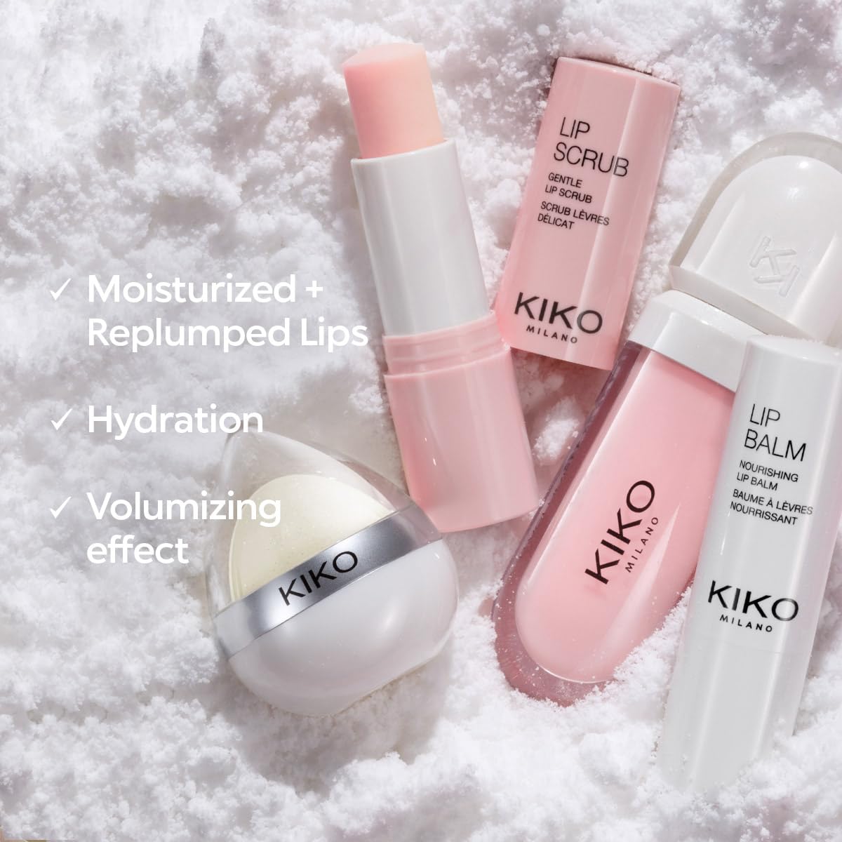 Diversos produtos Kiko Milano, incluindo creme labial volumizador Kiko Milano, em ambiente nevado