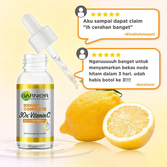 Sérum clareador de pele Garnier em frasco com pipeta, acompanhado de limão, ideal para clarear tons de pele e manchas