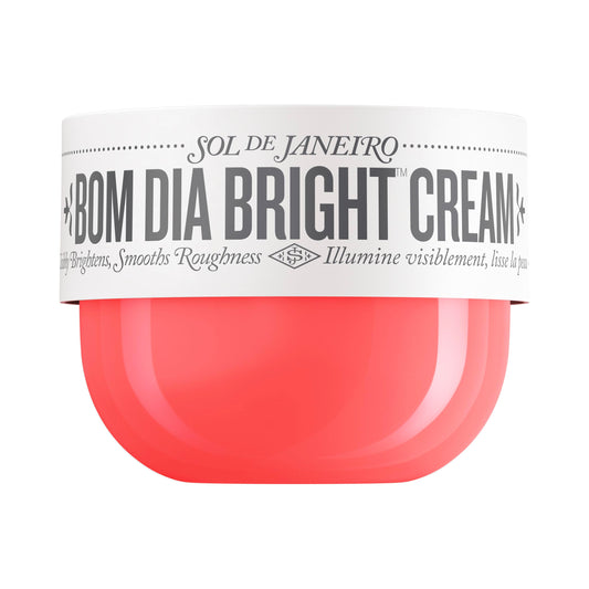 Creme corporal iluminador Sol de Janeiro Bom Dia em pote de 8 oz com tampa branca e corpo rosa
