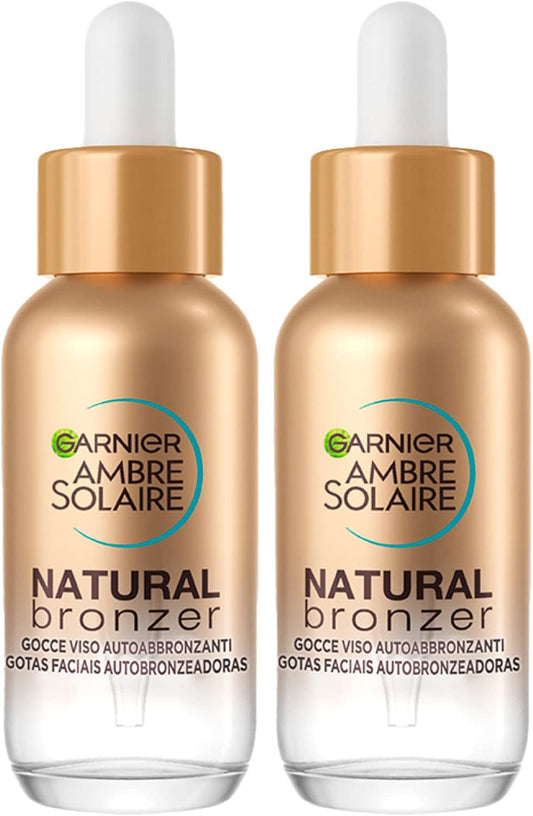 Produto vegano para bronzeamento facial Garnier em frascos de 30 ml, com gotas autobronzeadoras de origem vegetal.