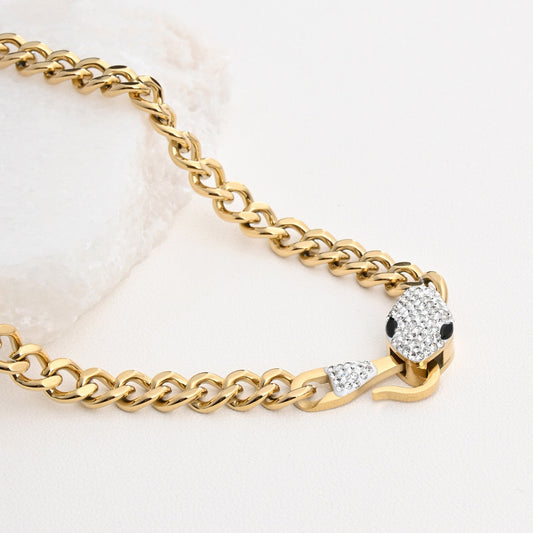 Collar de acero con serpiente y diamantes.